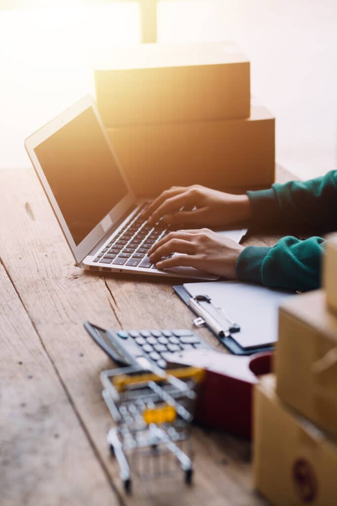 Concept of an online purchase with a laptop and a shopping cart